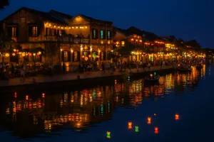 Hoi An’s lantern-lit streets and reflections on the Thu Bon River at night.